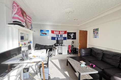 A bright, spacious living room with comfortable...