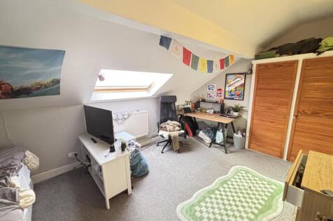 Bright and welcoming living room featuring a la...