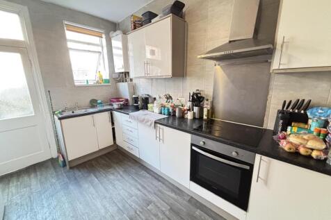 A well-maintained kitchen featuring modern cabi...