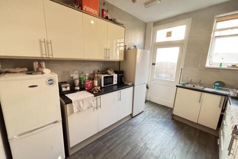 A well-lit and functional kitchen space with am...