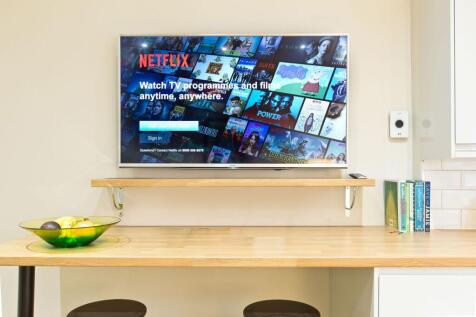Bright, modern kitchen nook with a wall-mounted...