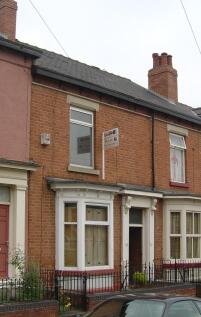 Red-brick terraced house with bay window, decor...