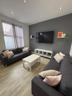 Bright, modern living room with two comfortable...