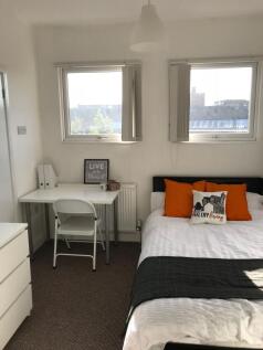 Bright, neatly presented bedroom with a double ...