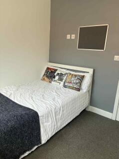 Bright, neatly presented bedroom with a double ...