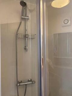 Contemporary tiled shower enclosure with adjust...
