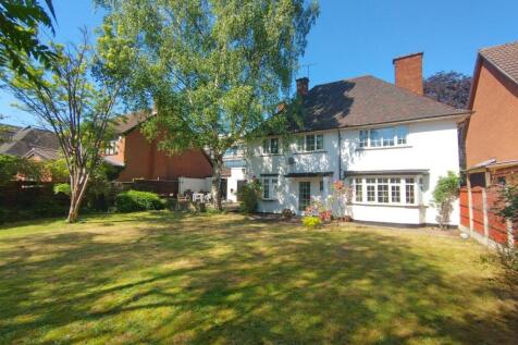 Sunny private rear garden with a spacious lawn,...