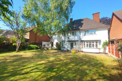 Sunny private rear garden with a large lawn, ma...
