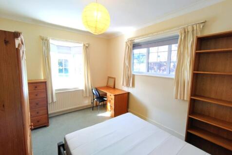 Bright, tastefully furnished bedroom with two l...