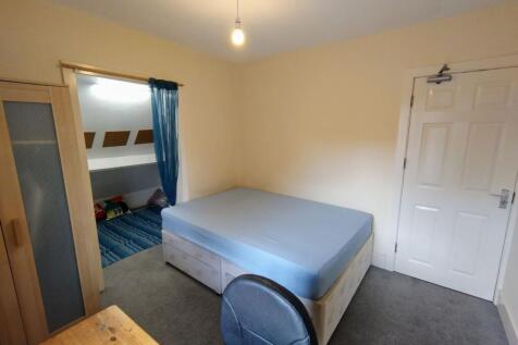 Bright, neatly presented bedroom with a double ...