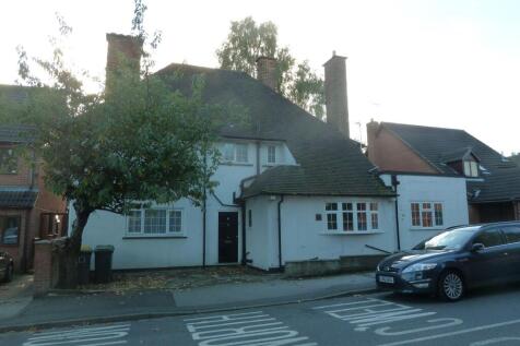 Charming semi-detached house with white exterio...