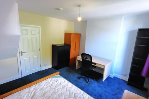 Bright, well-presented bedroom with a study des...