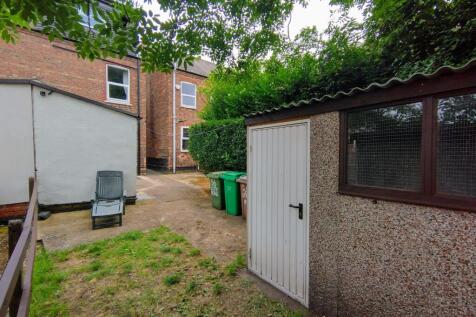 Private rear garden with a paved area, lawn pat...