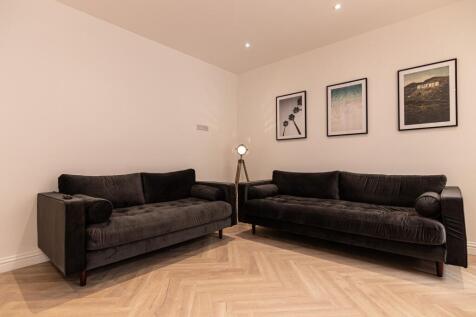 Contemporary living room with two matching dark...