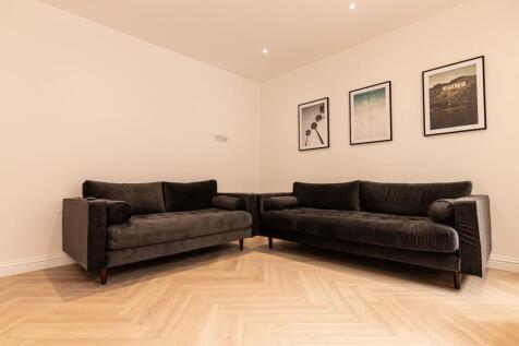 Contemporary living room with two matching dark...