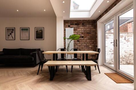 Bright contemporary living and dining area with...