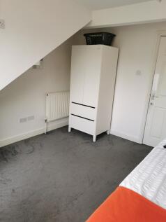 Bright, tidy bedroom with neutral décor, fitted...