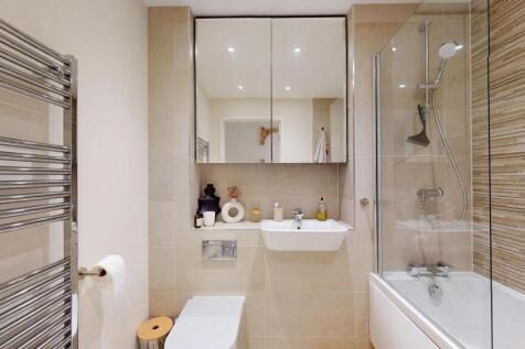 A clean and modern bathroom featuring a spaciou...