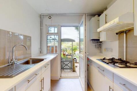 Bright and functional kitchen with clean surfac...