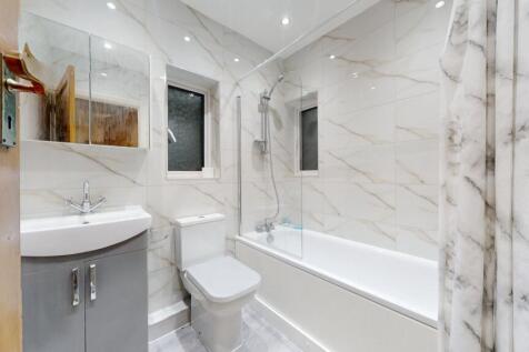 Modern and well-maintained bathroom with a spac...