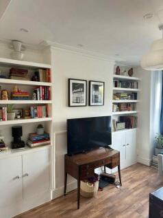 A bright and inviting living room featuring a m...