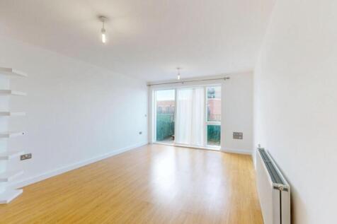 Bright and spacious living room with warm woode...