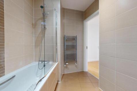 A modern and well-maintained bathroom suite fea...