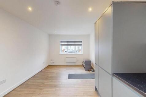 Bright, modern living area with neutral décor, ...