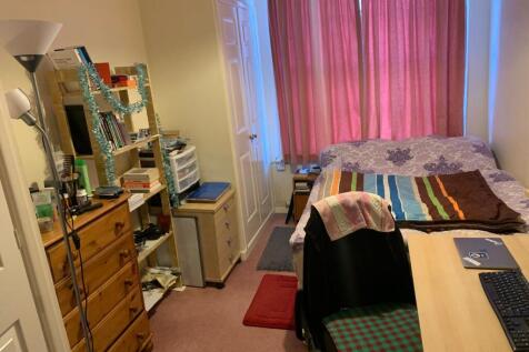 Bright, well-furnished bedroom with a comfy bed...