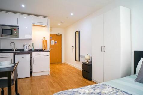 Bright, modern studio room with a fitted kitche...