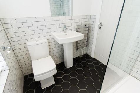 Modern bathroom with white sanitaryware, subway...