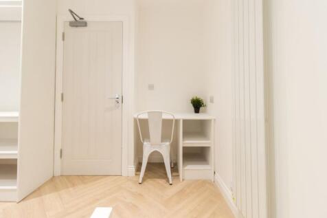 Bright, minimal study corner with a white desk ...
