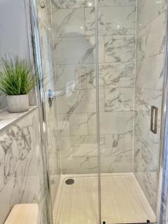 Contemporary tiled shower enclosure with glass ...
