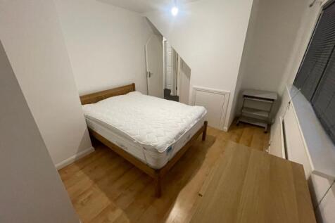 A neat and well-maintained bedroom featuring a ...