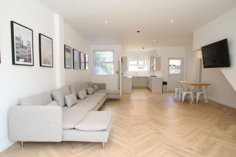 Bright, modern open-plan living area with a lon...