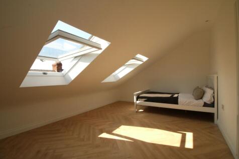 Bright, recently refurbished attic bedroom with...
