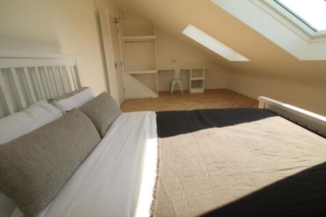Bright, airy attic double bedroom with a large ...