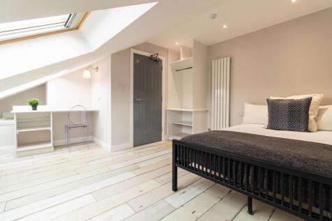 Bright, modern bedroom with a comfortable doubl...