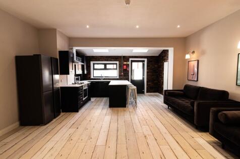 Contemporary open-plan living area with a fitte...