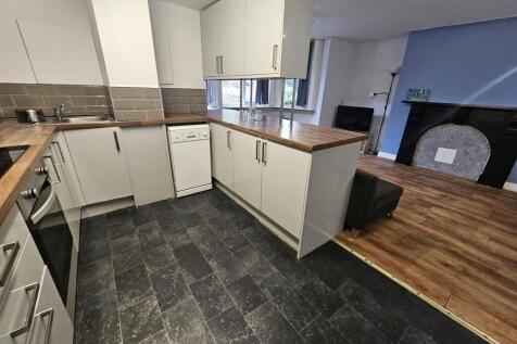 Modern kitchen with integrated appliances, ligh...