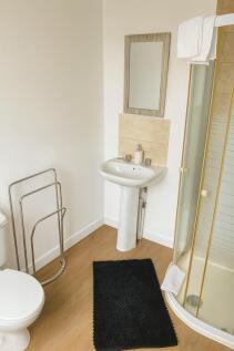 A clean and well-maintained bathroom featuring ...