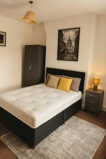 A modern double bedroom featuring a comfortable...