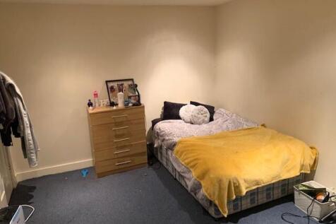 A spacious and inviting master bedroom featurin...