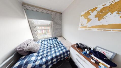 A small bathroom featuring basic fixtures with ...