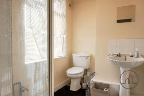 A bright and well-maintained bathroom featuring...