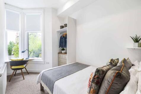 Bright and inviting double bedroom featuring a ...