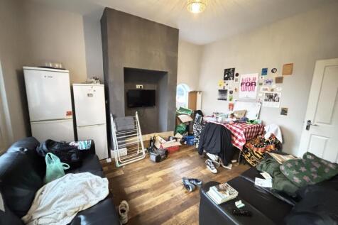 A cozy living room featuring a mix of furniture...