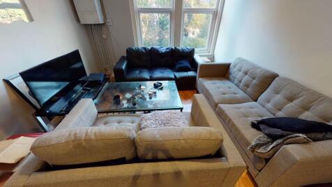 A spacious and inviting living area featuring m...