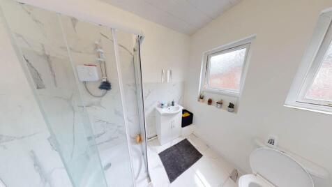 Bright and well-maintained bathroom featuring a...