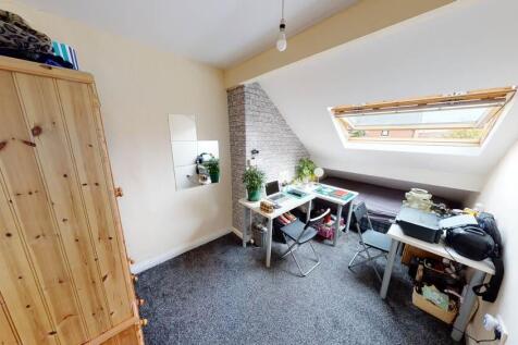 Bright and welcoming bedroom with ample natural...